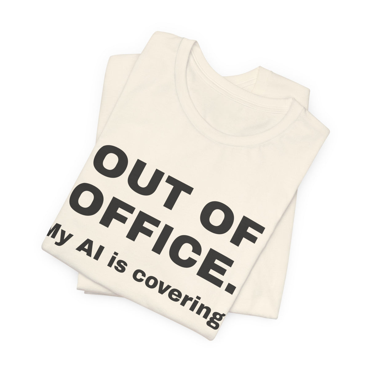 Natural t-shirt printed with 'Out of office. My AI is covering.', folded