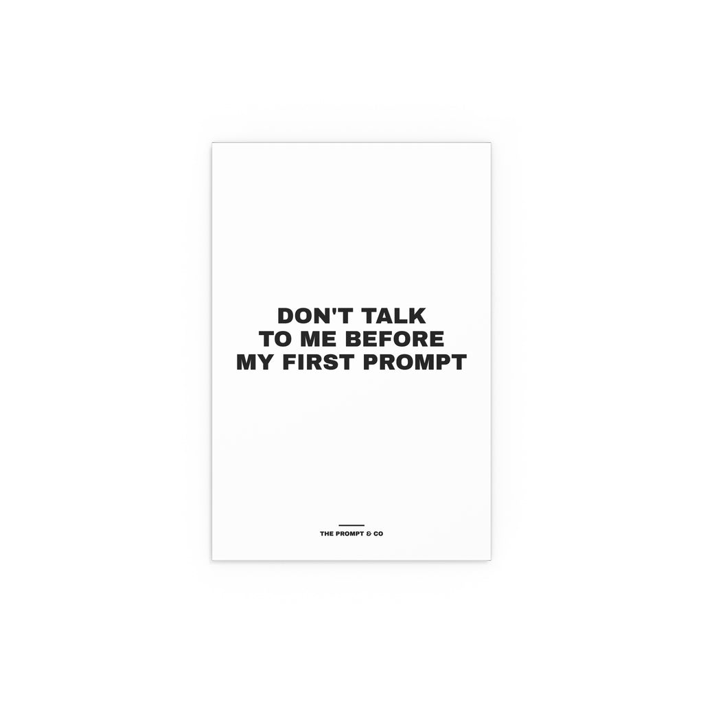 Wall print reading 'Don't talk to me before my first prompt'