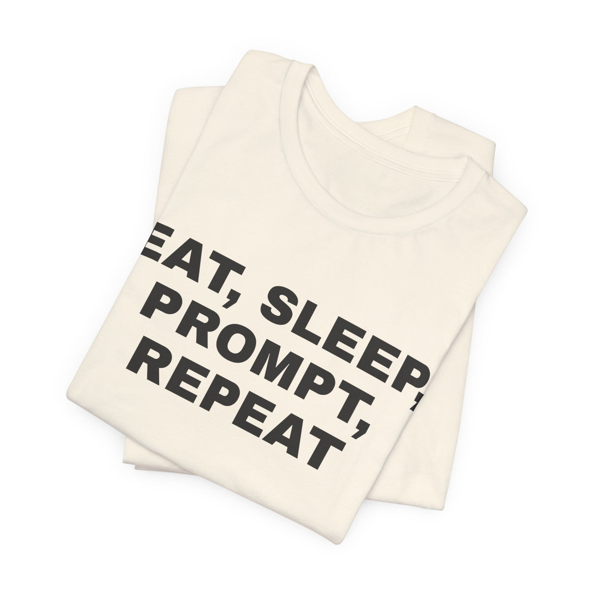 Natural t-shirt printed with 'Eat, sleep, prompt, repeat', folded