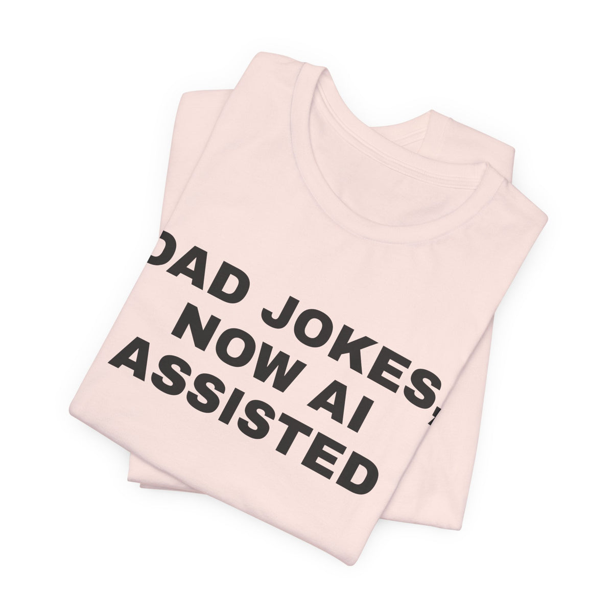 Soft pink t-shirt printed with 'Dad jokes, now AI assisted', folded