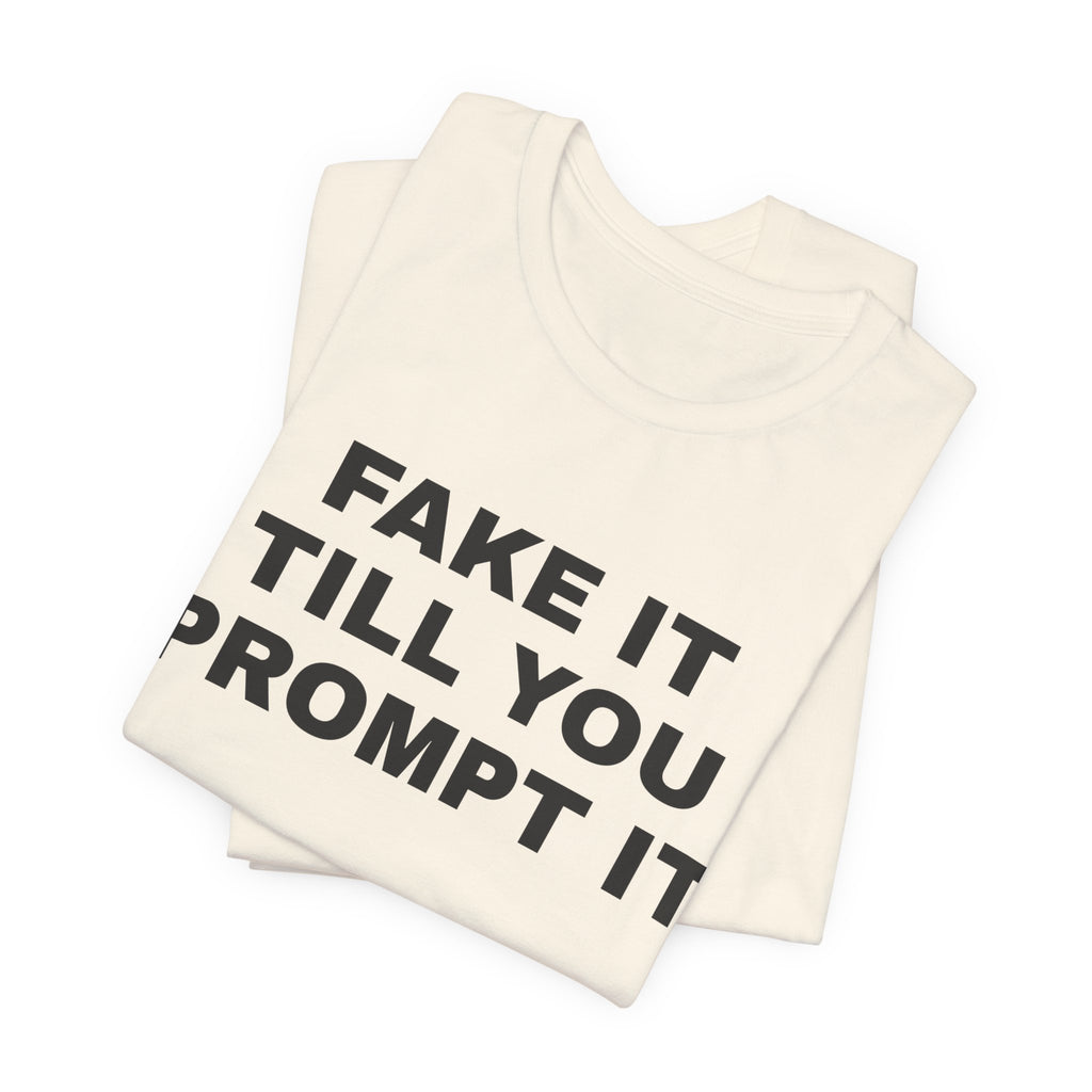 Natural t-shirt printed with 'Fake it till you prompt it', folded