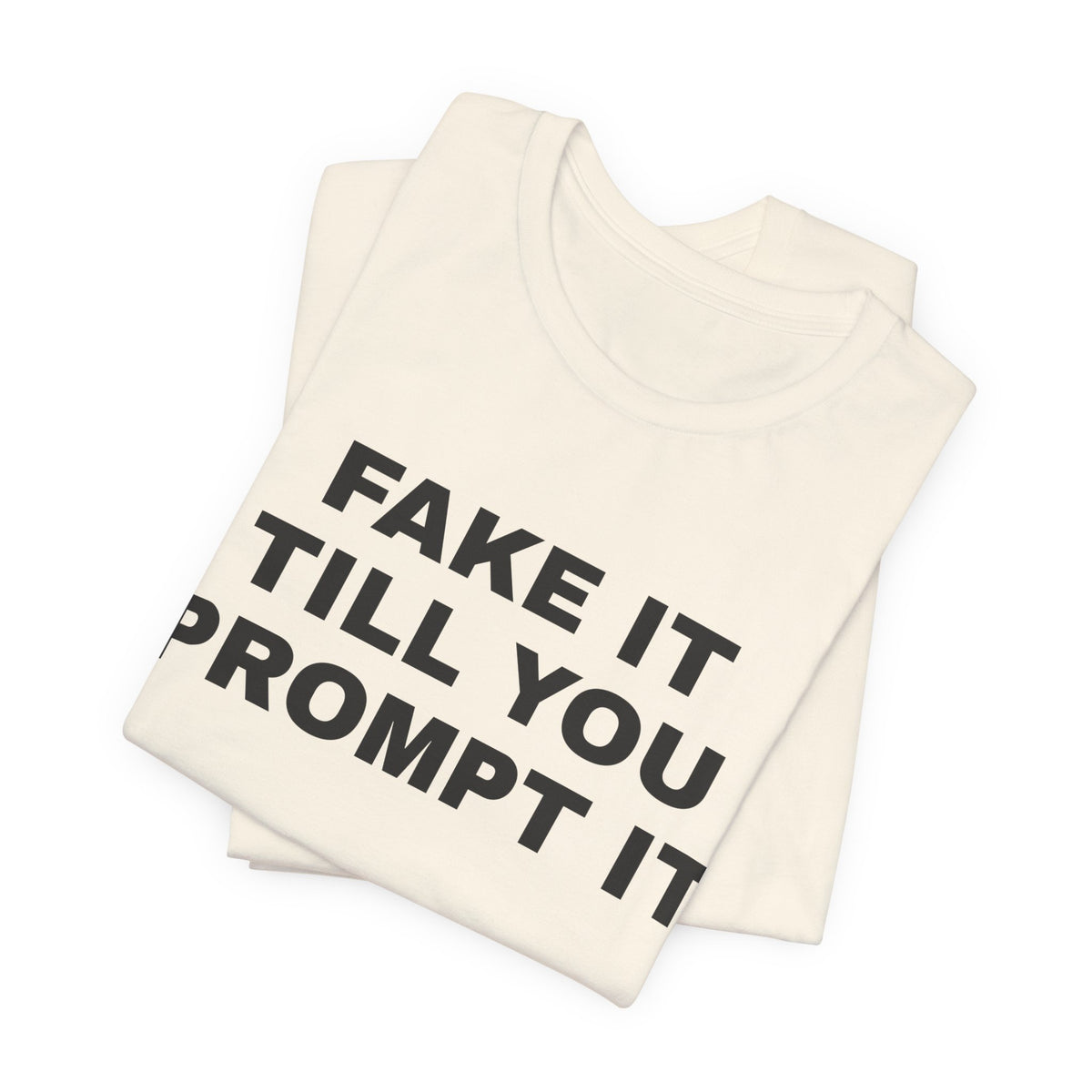 Natural t-shirt printed with 'Fake it till you prompt it', folded