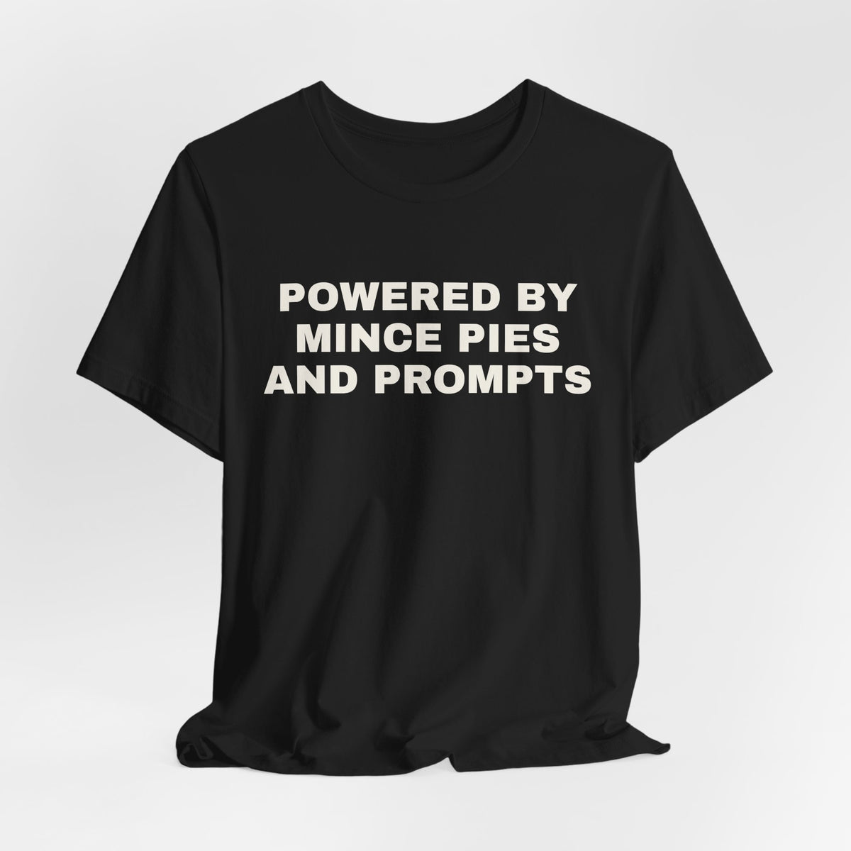 Black t-shirt printed with 'Powered by Mince Pies and Prompts'