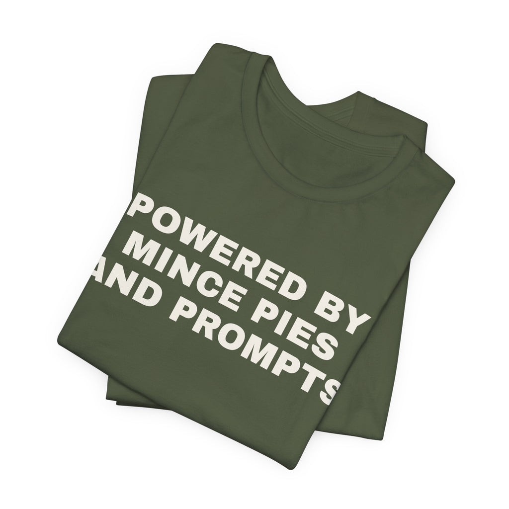 Military green t-shirt printed with 'Powered by Mince Pies and Prompts', folded