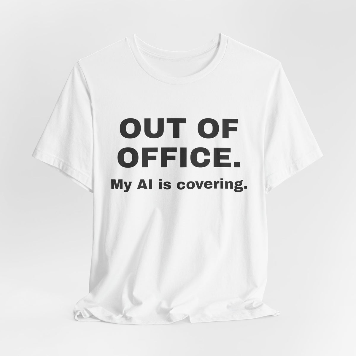 White t-shirt printed with 'Out of office. My AI is covering.'