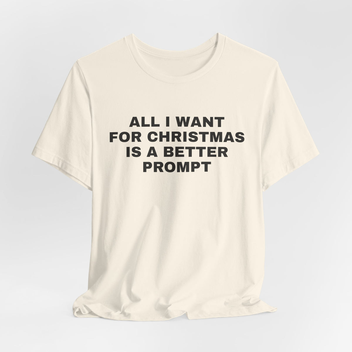 Natural t-shirt printed with 'All I want for Christmas is a better prompt'