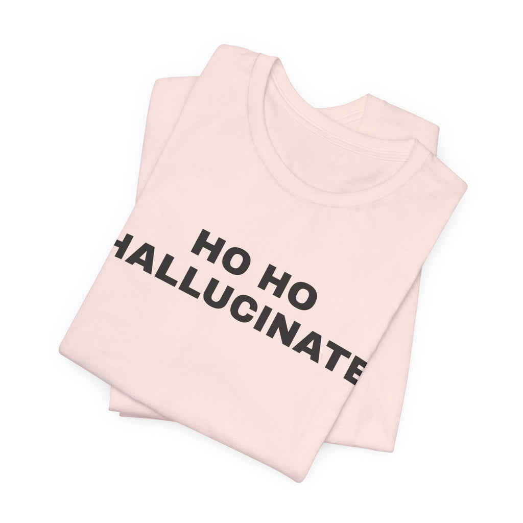 Soft pink t-shirt printed with 'Ho Ho Hallucinate', folded