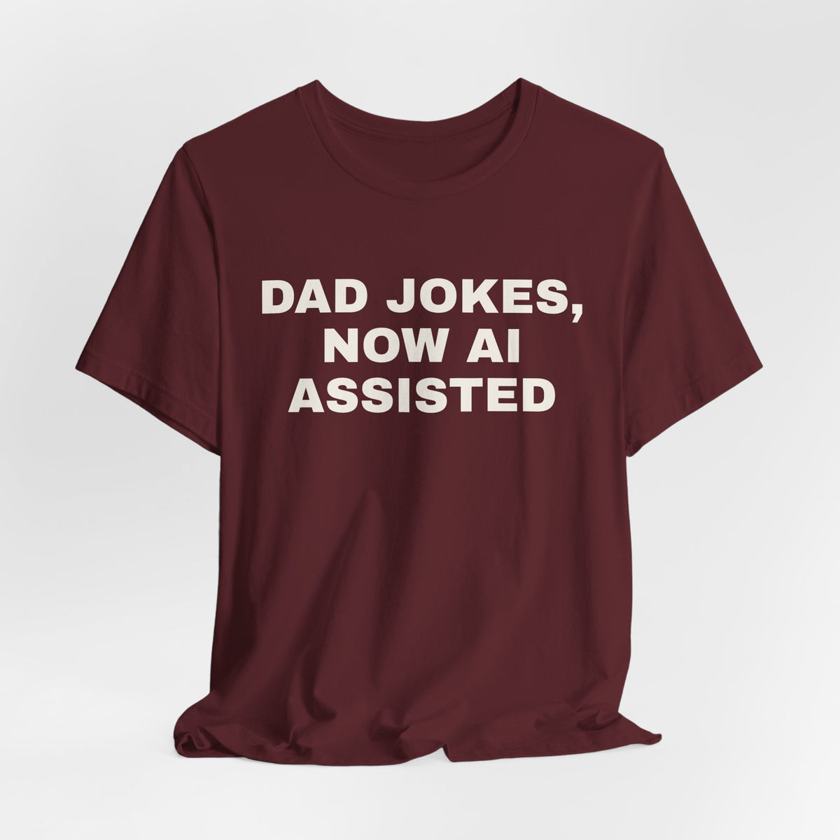 Maroon t-shirt printed with 'Dad jokes, now AI assisted'