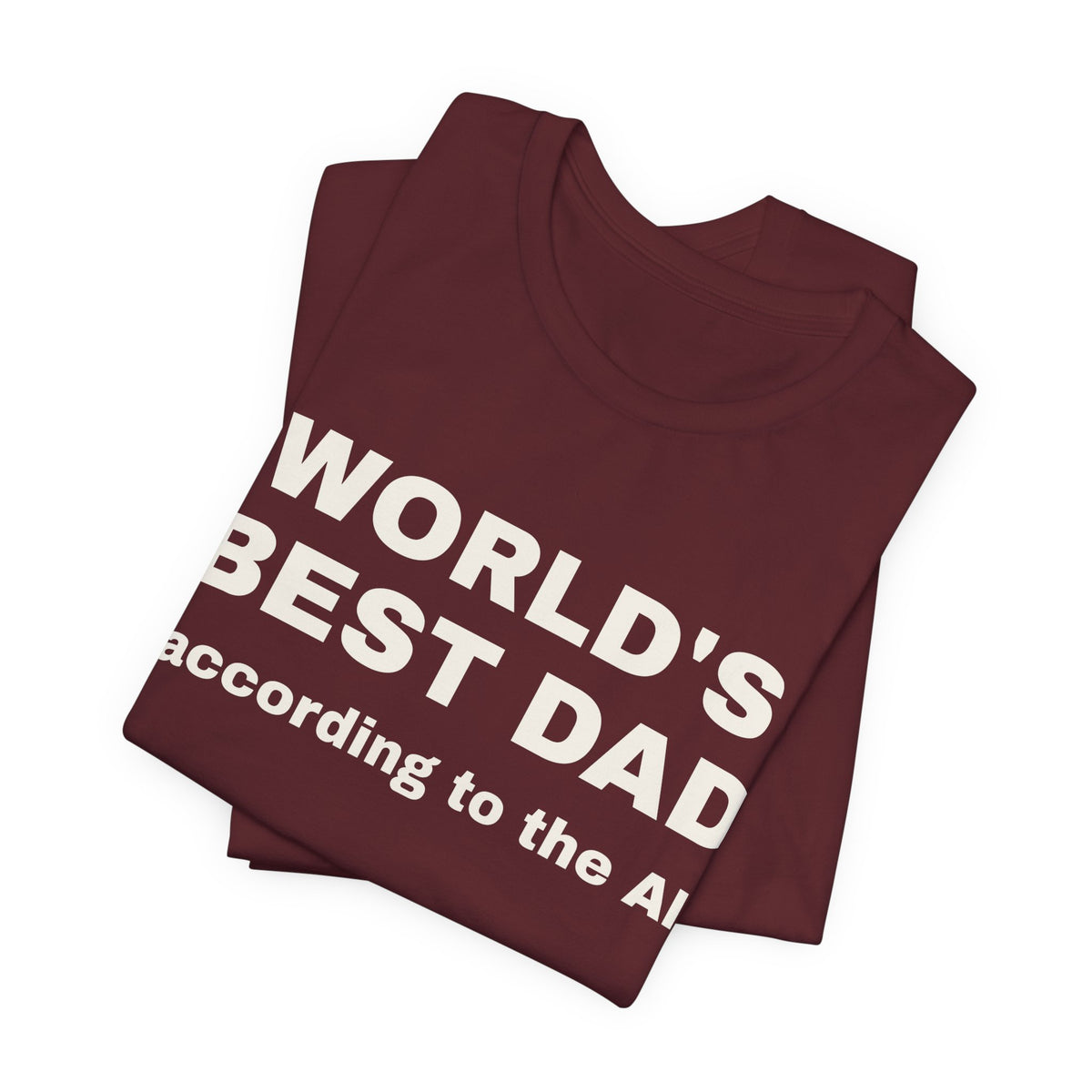 Maroon t-shirt printed with 'World's best dad, according to the AI', folded