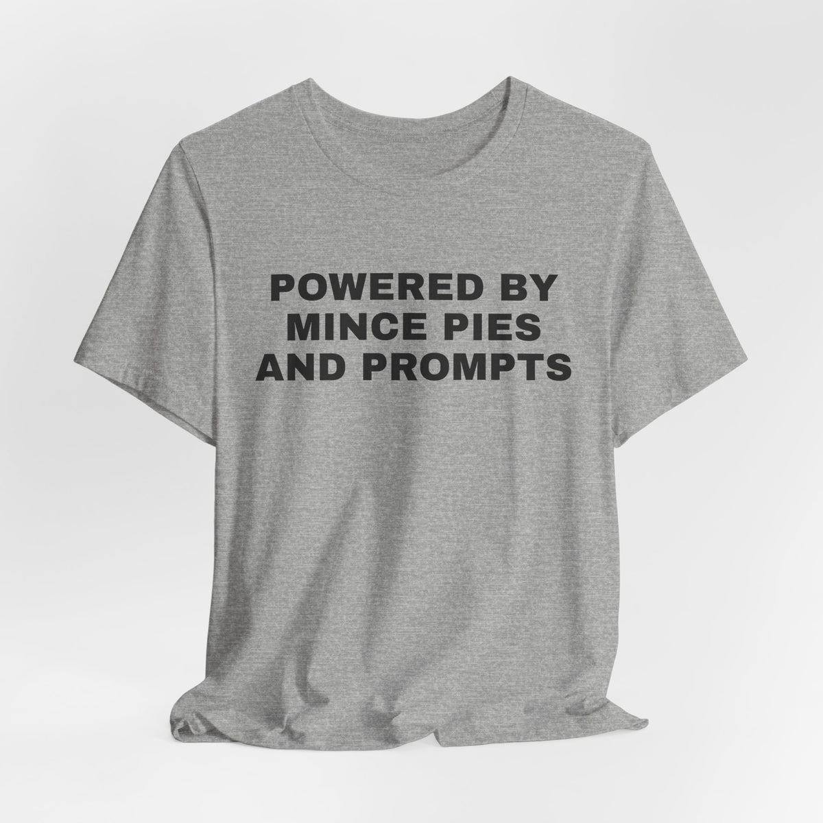 Athletic heather t-shirt printed with 'Powered by Mince Pies and Prompts'