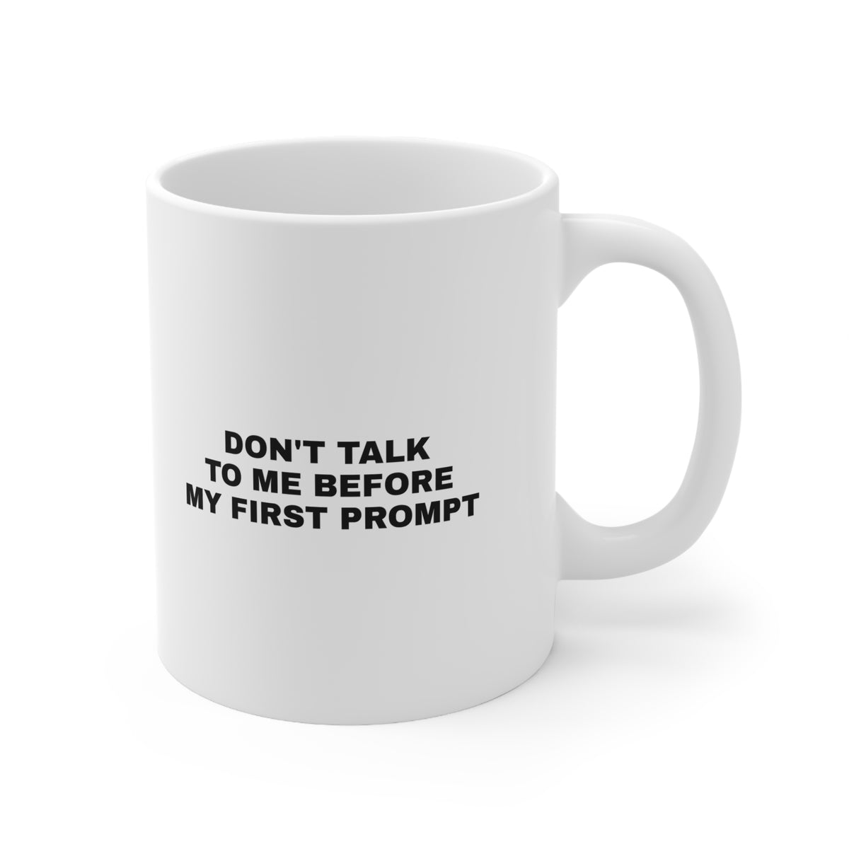 White mug printed with 'Don't talk to me before my first prompt'