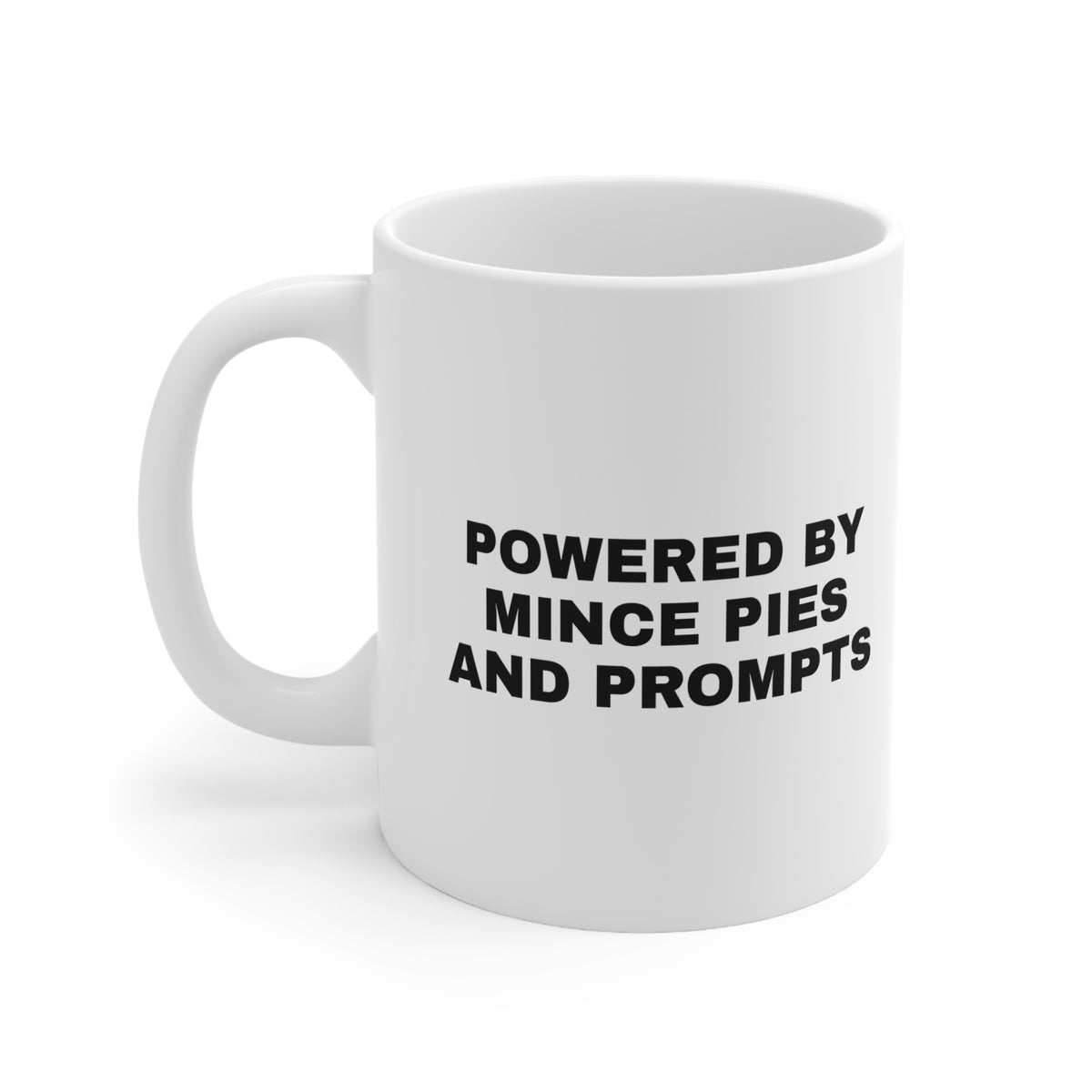 White mug printed with 'Powered by Mince Pies and Prompts'