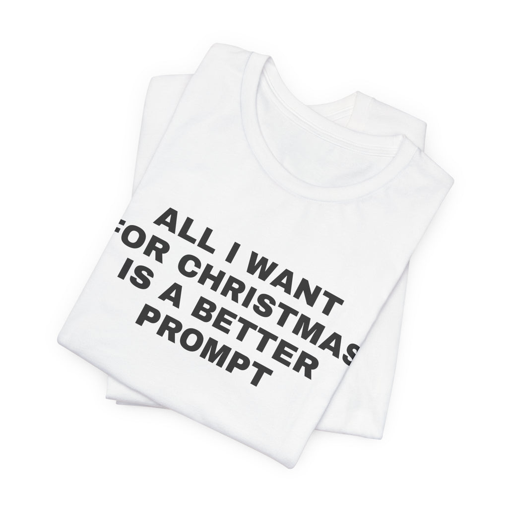 White t-shirt printed with 'All I want for Christmas is a better prompt', folded
