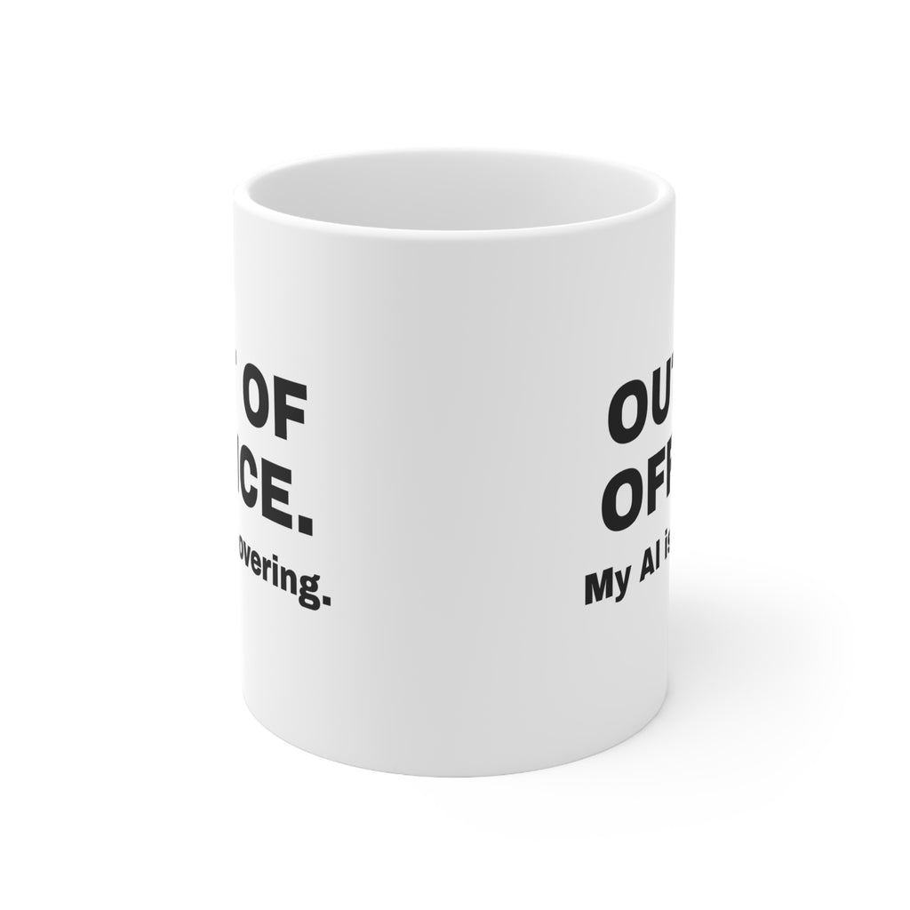 White mug printed with 'Out of office. My AI is covering.'