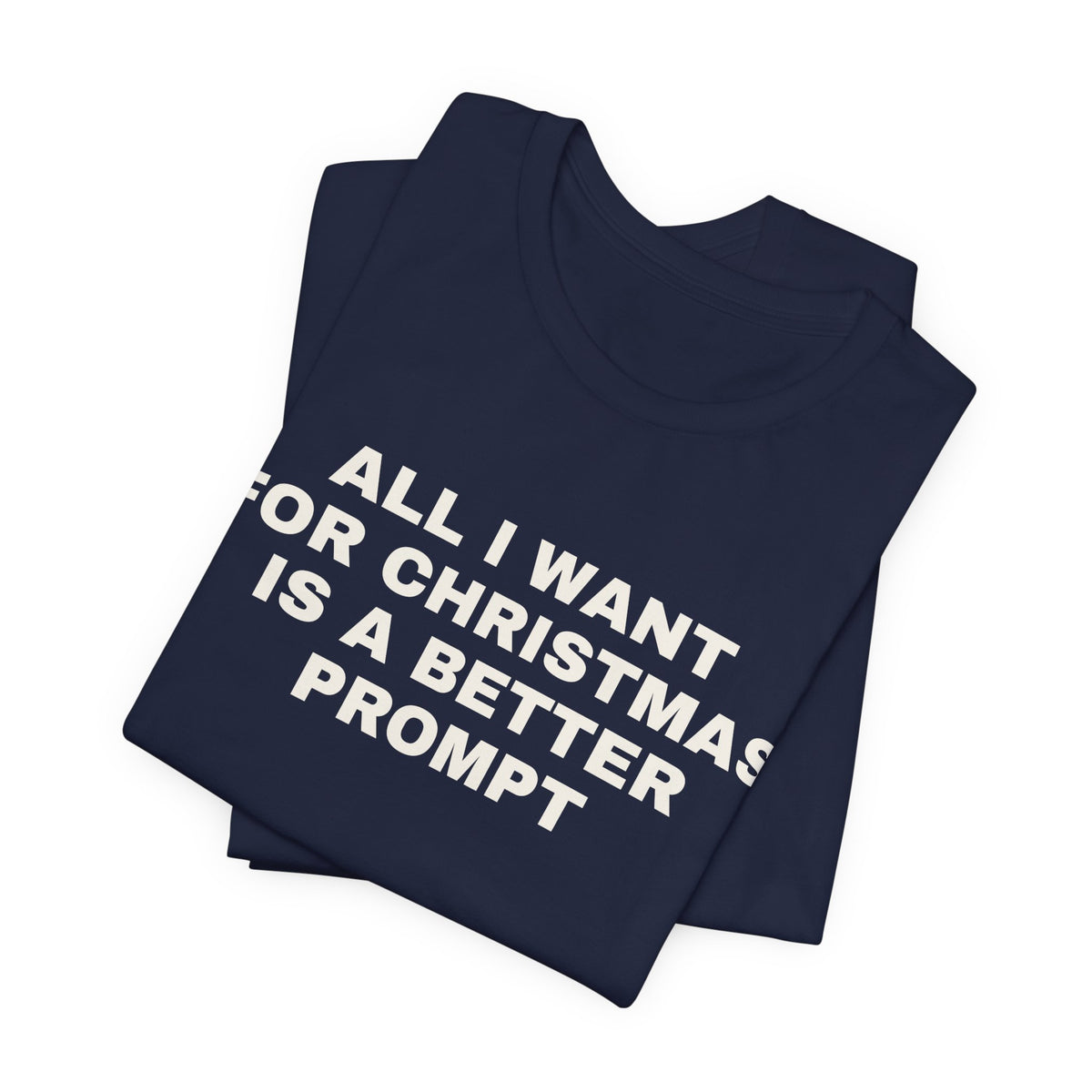 Navy t-shirt printed with 'All I want for Christmas is a better prompt', folded