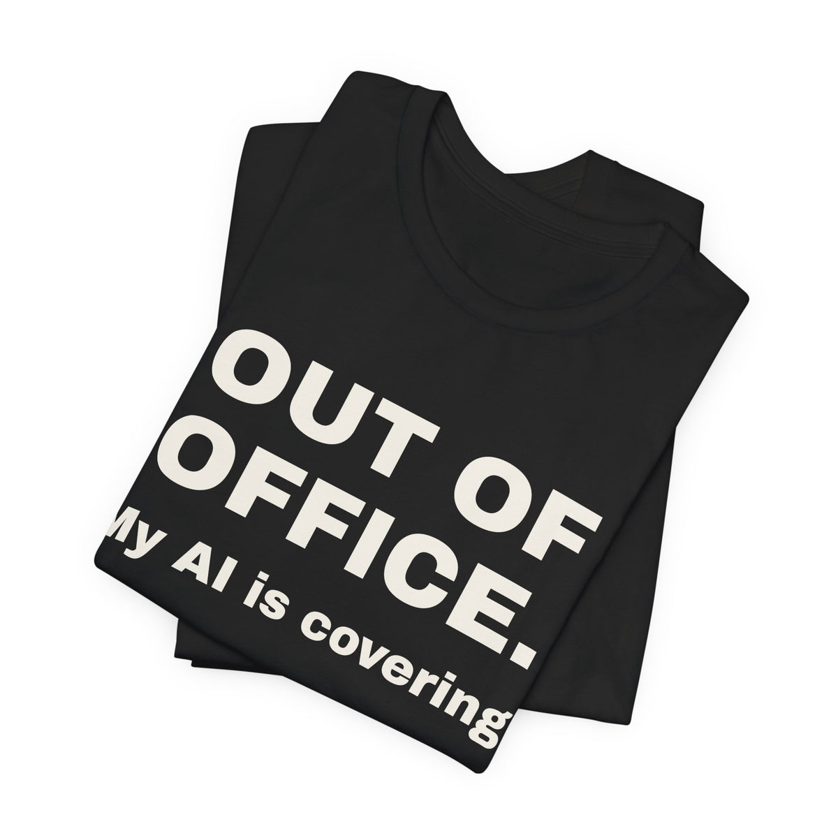 Black t-shirt printed with 'Out of office. My AI is covering.', folded