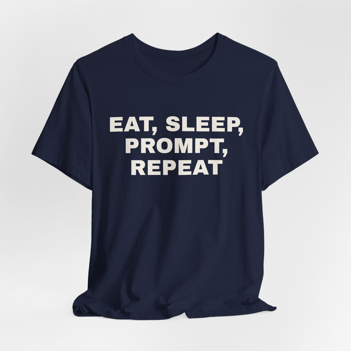 Navy t-shirt printed with 'Eat, sleep, prompt, repeat'