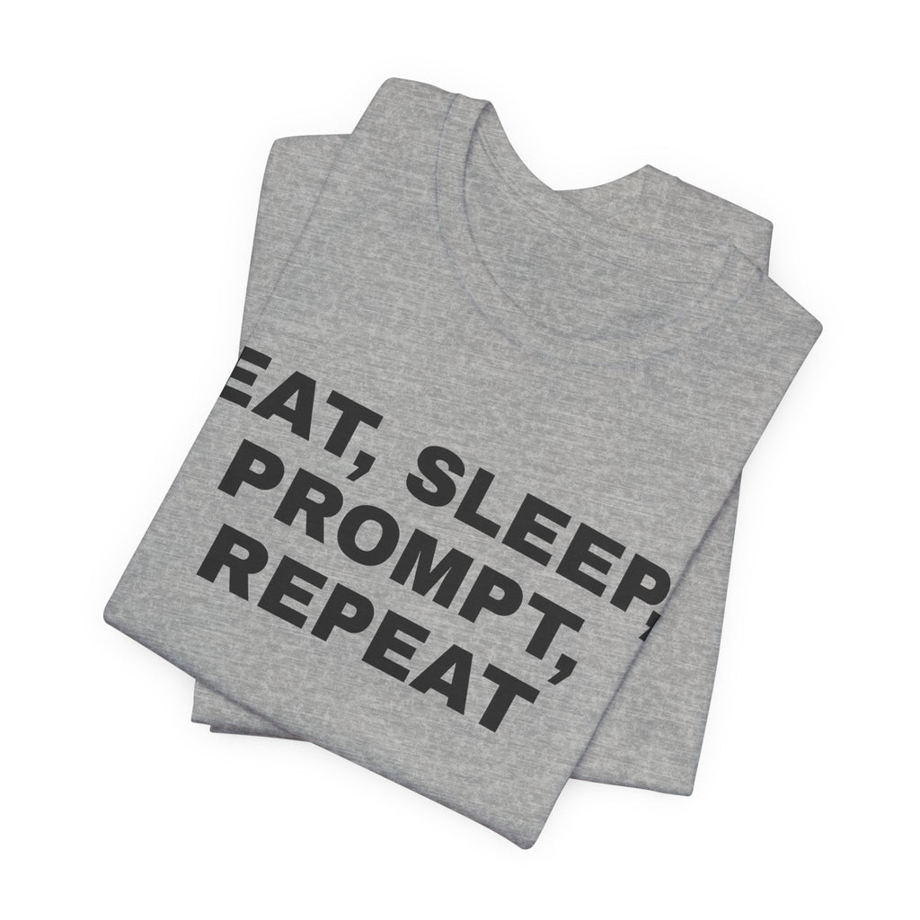 Athletic heather t-shirt printed with 'Eat, sleep, prompt, repeat', folded