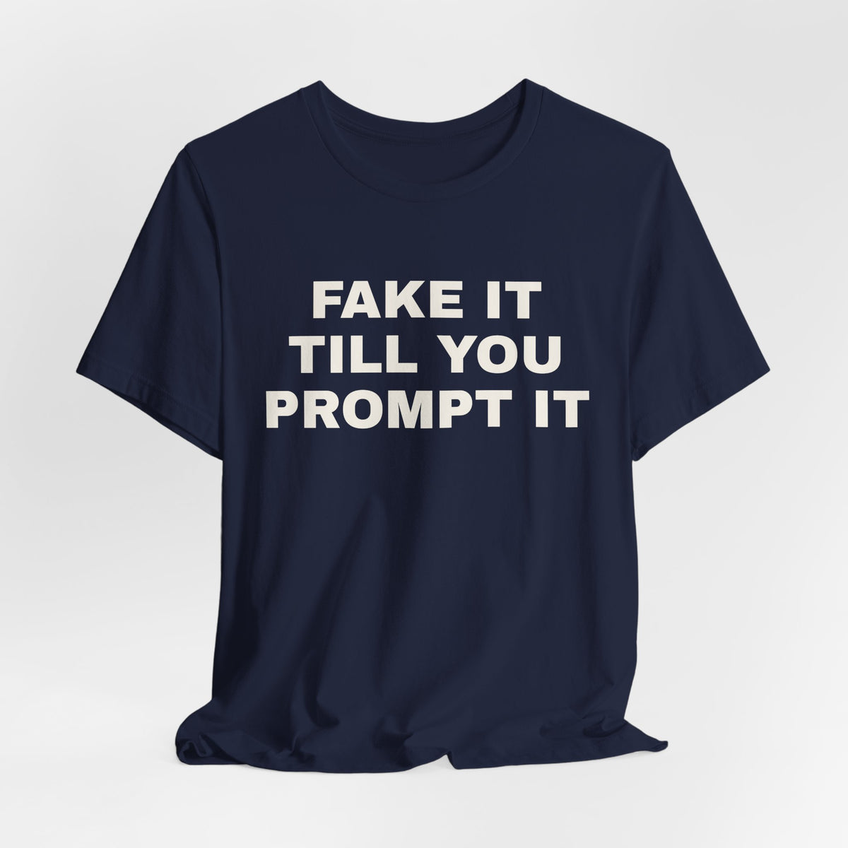 Navy t-shirt printed with 'Fake it till you prompt it'