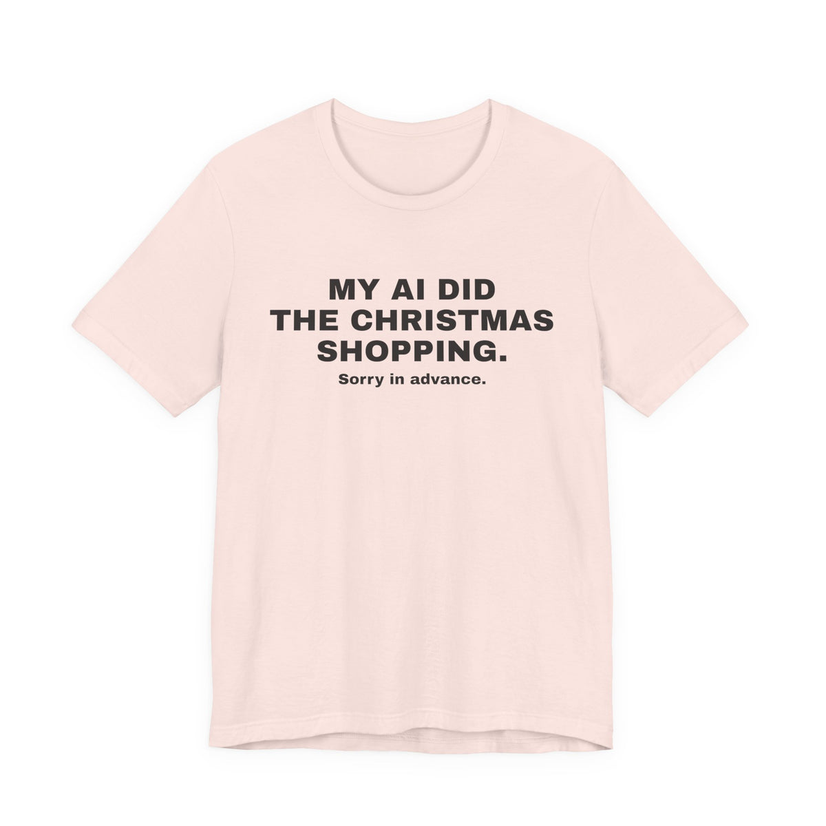 Soft pink t-shirt printed with 'My AI Did the Christmas Shopping. Sorry in Advance.'