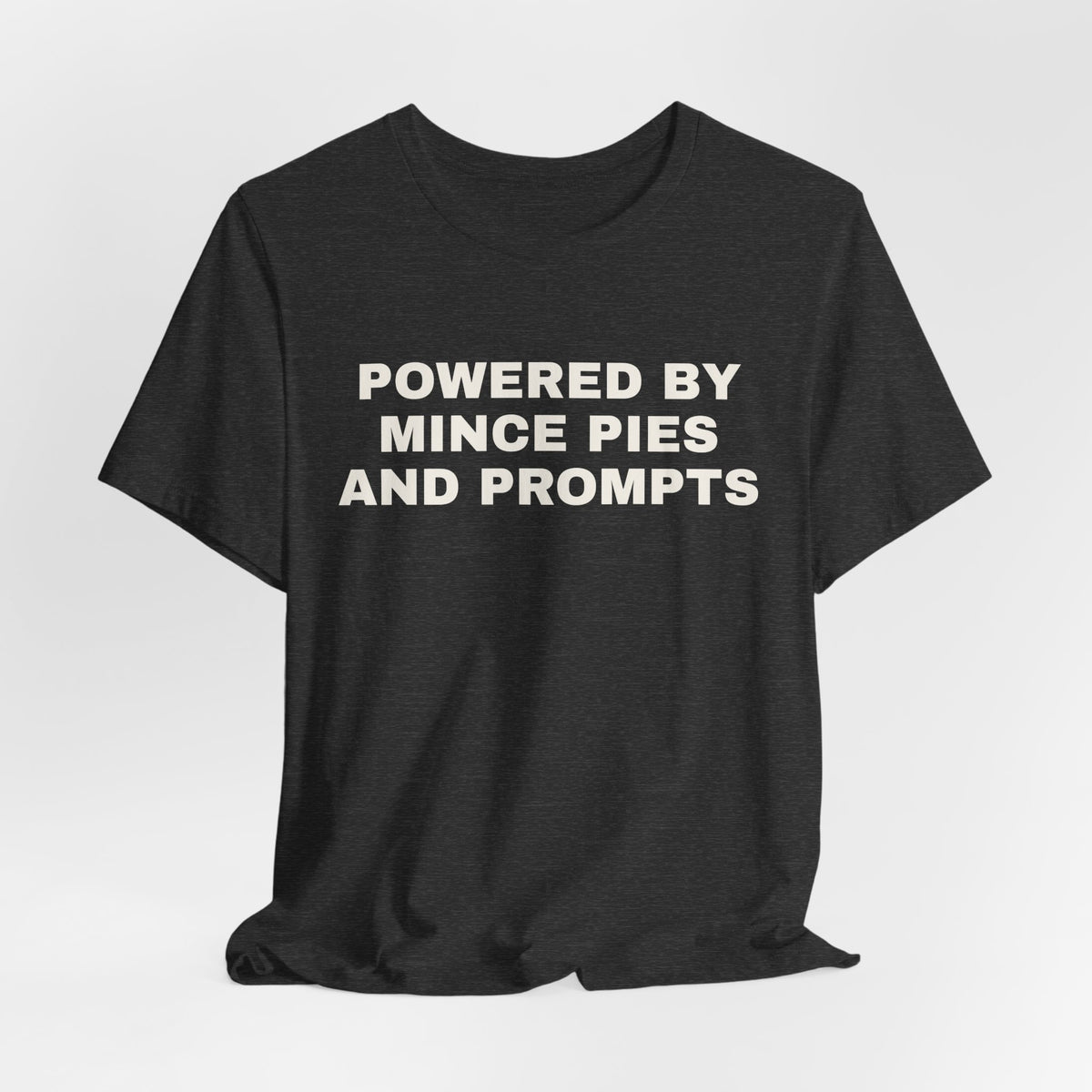 Dark grey heather t-shirt printed with 'Powered by Mince Pies and Prompts'