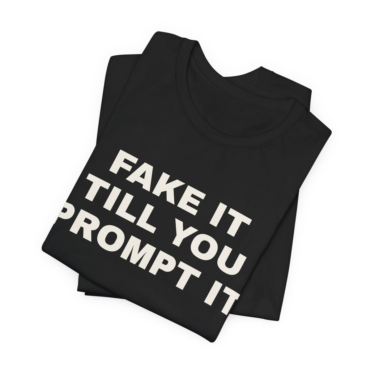 Black t-shirt printed with 'Fake it till you prompt it', folded