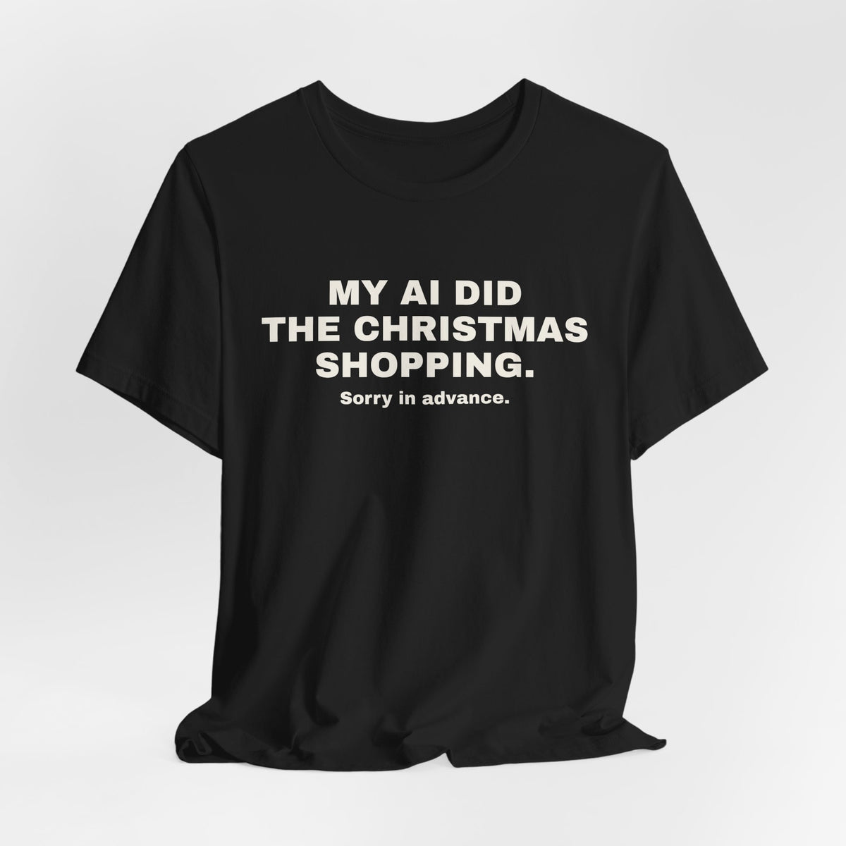 Black t-shirt printed with 'My AI Did the Christmas Shopping. Sorry in Advance.'