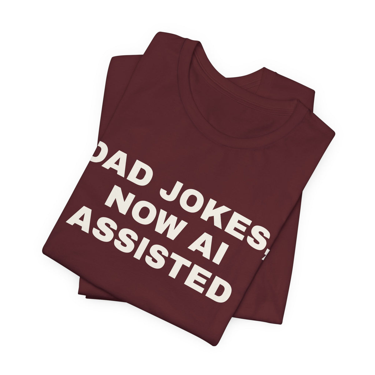 Maroon t-shirt printed with 'Dad jokes, now AI assisted', folded