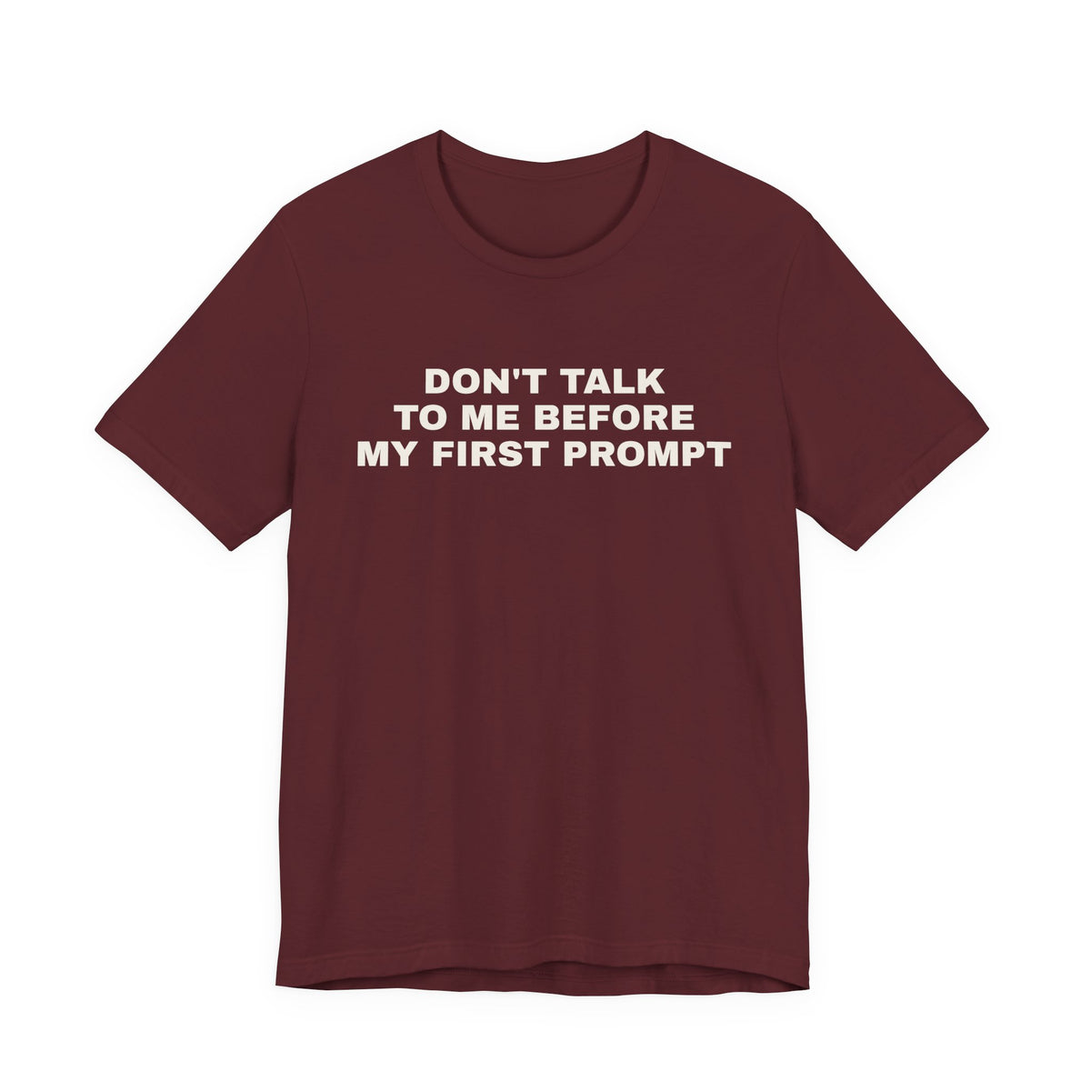 Maroon t-shirt printed with 'Don't talk to me before my first prompt'