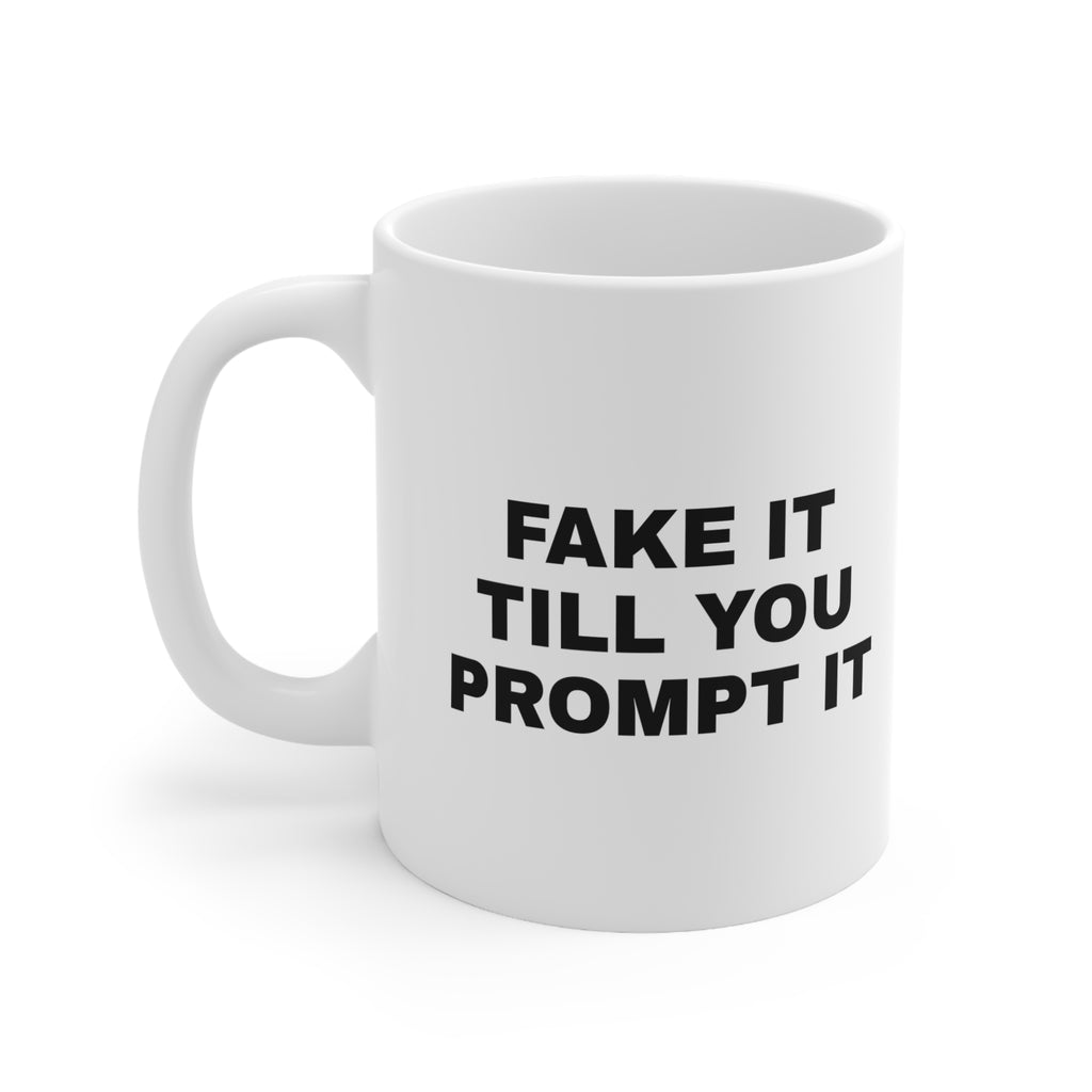 White mug printed with 'Fake it till you prompt it'