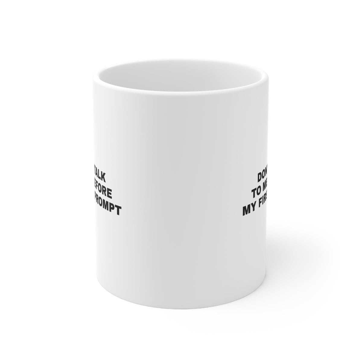 White mug printed with 'Don't talk to me before my first prompt'