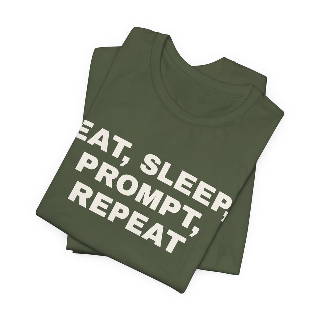 Military green t-shirt printed with 'Eat, sleep, prompt, repeat', folded