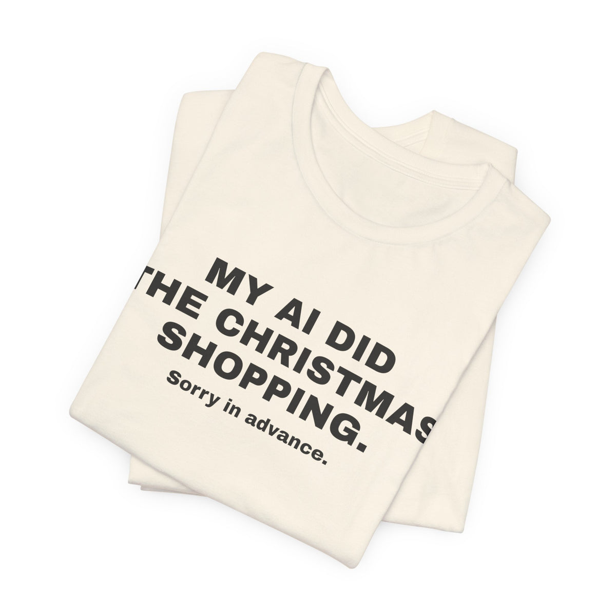 Natural t-shirt printed with 'My AI Did the Christmas Shopping. Sorry in Advance.', folded