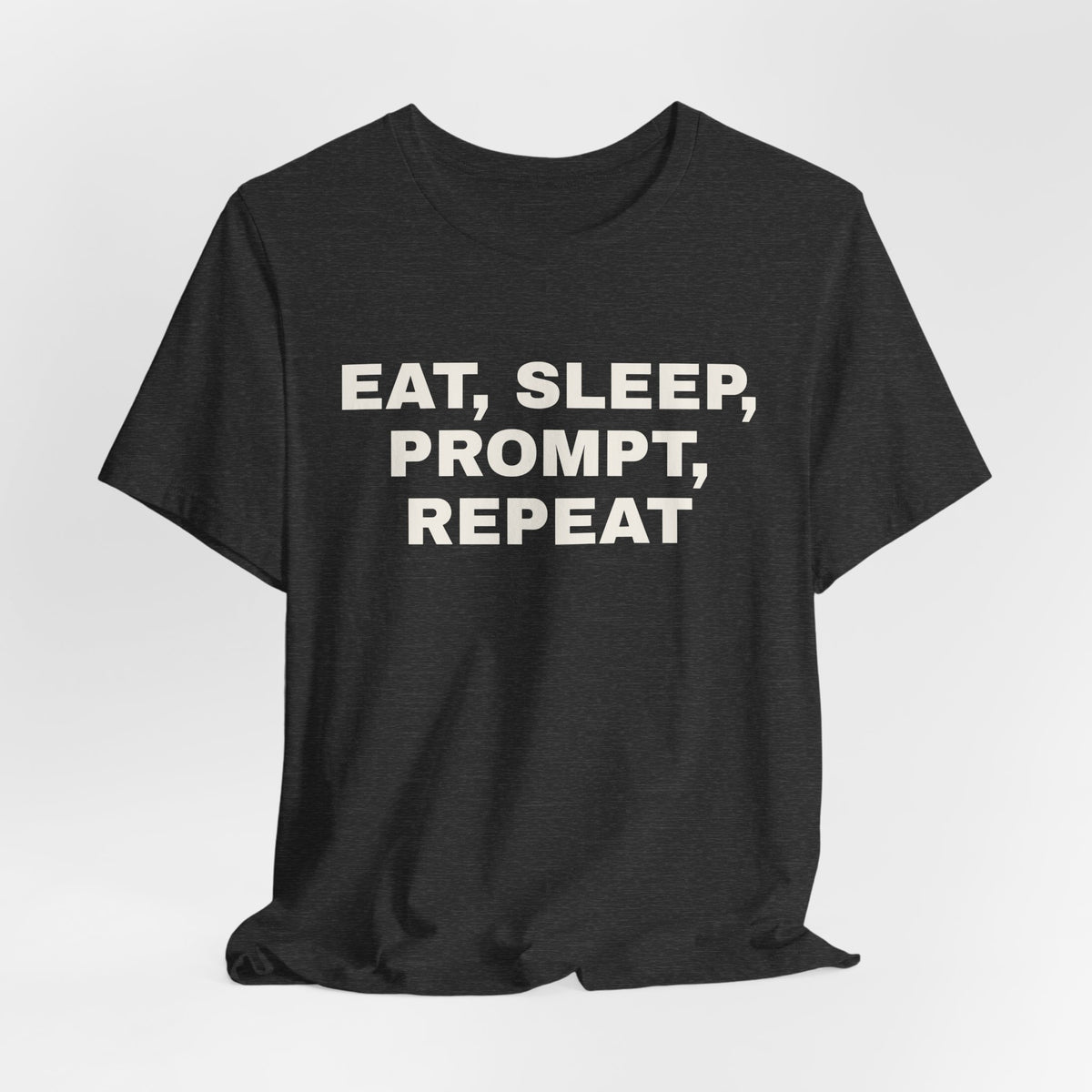 Dark grey heather t-shirt printed with 'Eat, sleep, prompt, repeat'