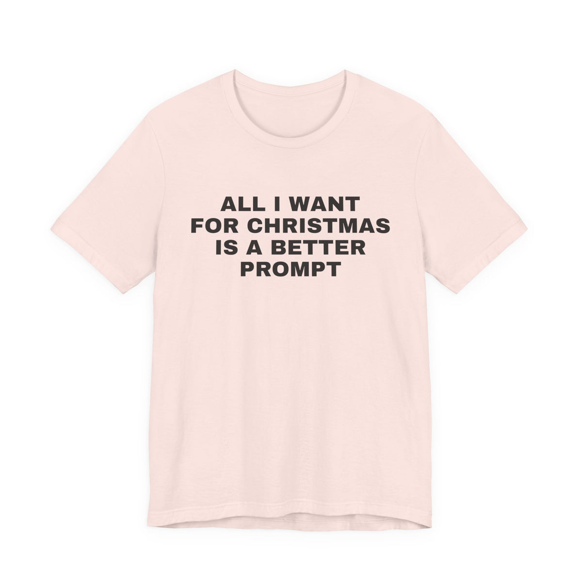 Soft pink t-shirt printed with 'All I want for Christmas is a better prompt'