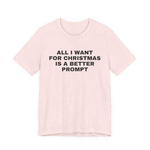 Soft pink t-shirt printed with 'All I want for Christmas is a better prompt'